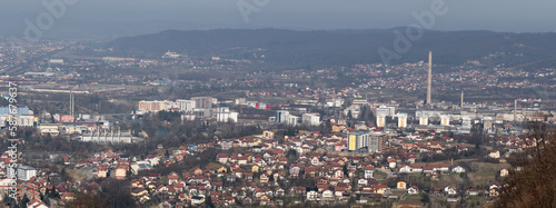 Panoramic view of Banja Luka city, distant hills fade in haze, air pollution in city