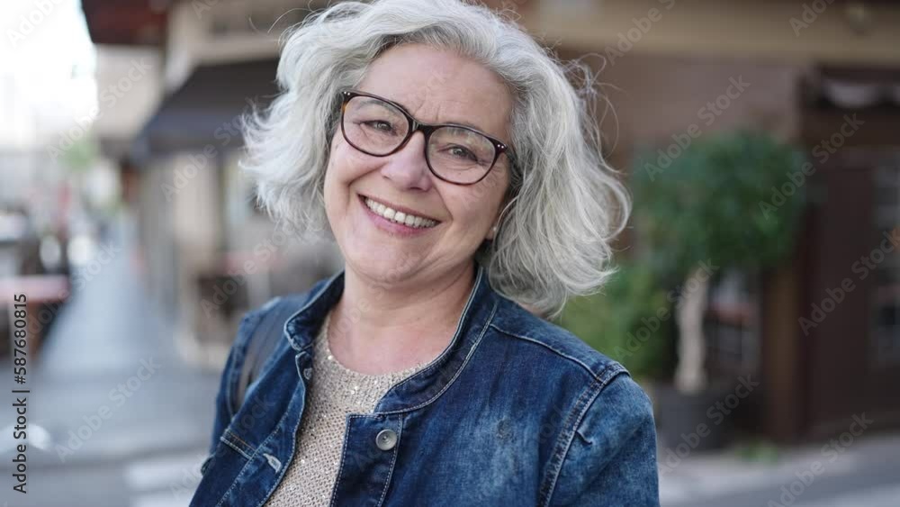 Middle age woman with grey hair smiling confident at street Middle age woman with grey hair smiling confident at street