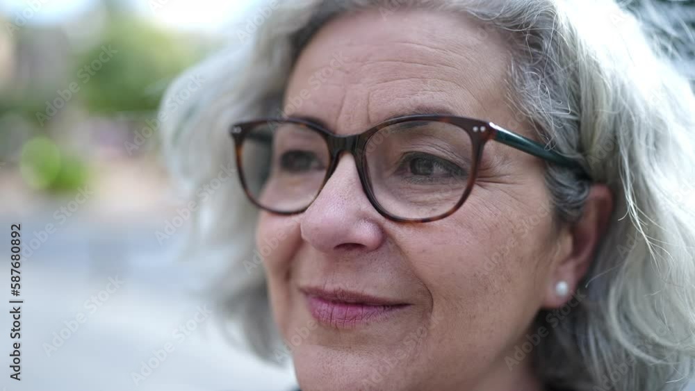 Middle age woman with grey hair smiling confident at street Middle age woman with grey hair smiling confident at street
