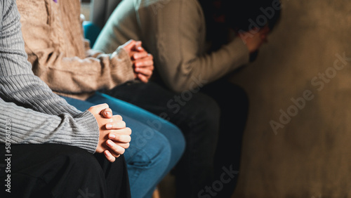 Small group of asian people praying worship believe. Teams of friends worship together before studying Holy bible. family praying together in church. Small group learning with prayer concept.