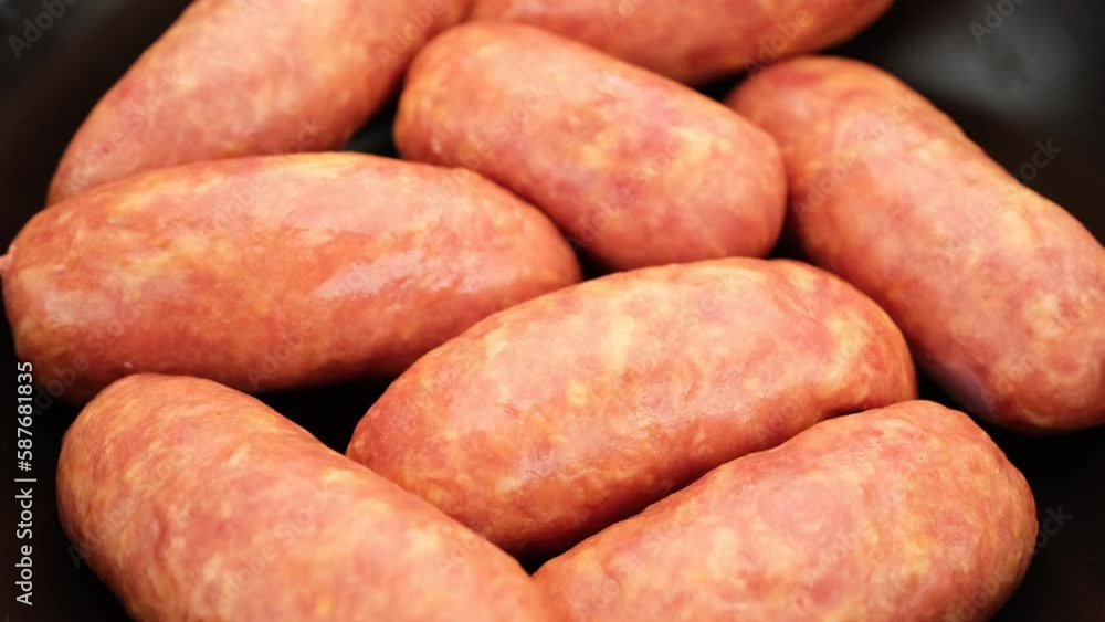 Sausages. Uncooked sausages preparation for grilling Sausages. Uncooked sausages preparation for grilling