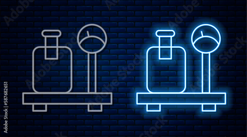 Glowing neon line Scale with suitcase icon isolated on brick wall background. Logistic and delivery. Weight of delivery package on a scale. Vector