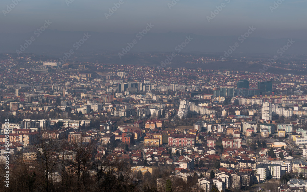 Cityscape of Banja Luka city during sunny day with haze in air