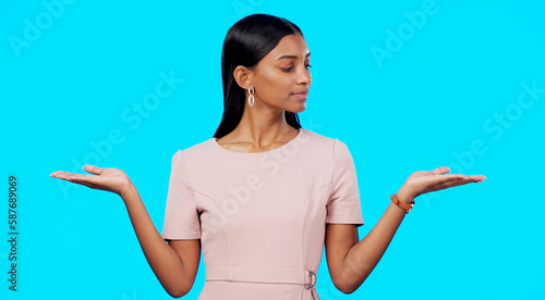Fotografie Choice, option or decision and a woman on a blue background in studio with a hand gesture