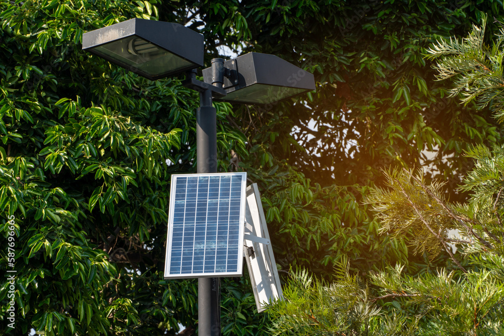 Solar Light. Public city light with solar panel powered on blue sky with clouds. Park public lighting pole with photovoltaic panel. renewable energy Solar Light. Public city light with solar panel powered on blue sky with clouds. Park public lighting pole with photovoltaic panel. renewable energy