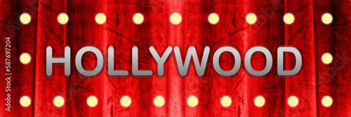 Red curtain with bulb lights and Hollywood silver colored lettering. Illustration made April 1st, 2023, Zurich, Switzerland.