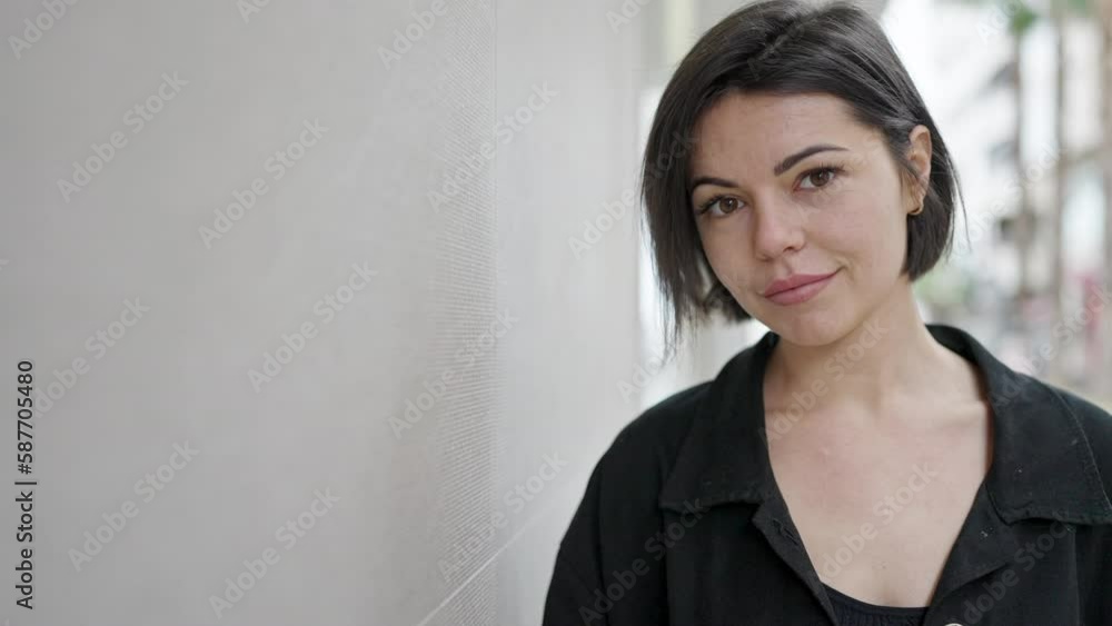 Young caucasian woman smiling confident covering camera with hand at street Young caucasian woman smiling confident covering camera with hand at street