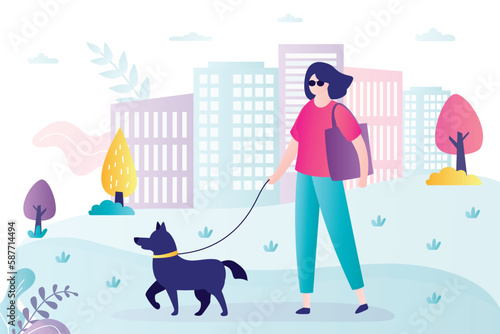 Blind woman walks with guide dog. Animal helps person with vision problems. Seeing Eye Dog provides someone who is blind or has low vision with confidence to get around safely