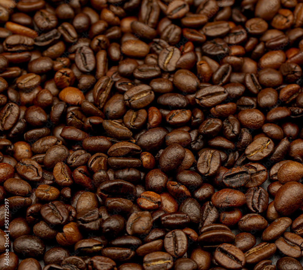 Fototapeta premium Espresso roasted coffee beans isolated in black background close up