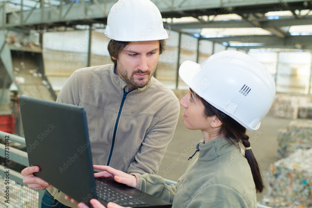 a recycling team checking laptop a recycling team checking laptop