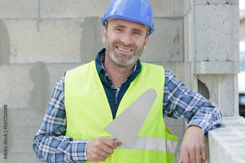 worker before plastering a wall worker before plastering a wall