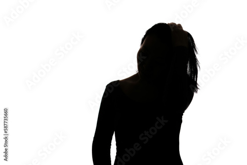 Fotografie Black backlit silhouette of head and shoulders of an oriental woman from front v