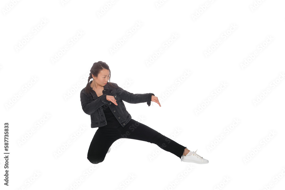 Obraz premium Asian young woman doing martial arts in everyday casual street clothing