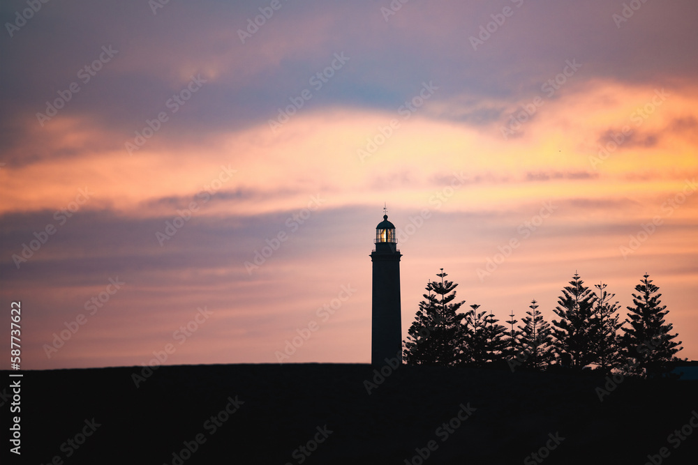 Stunning view of the Maspalomas lighthouse during a beautiful sunset. Gran Canaria, Canary Islands.