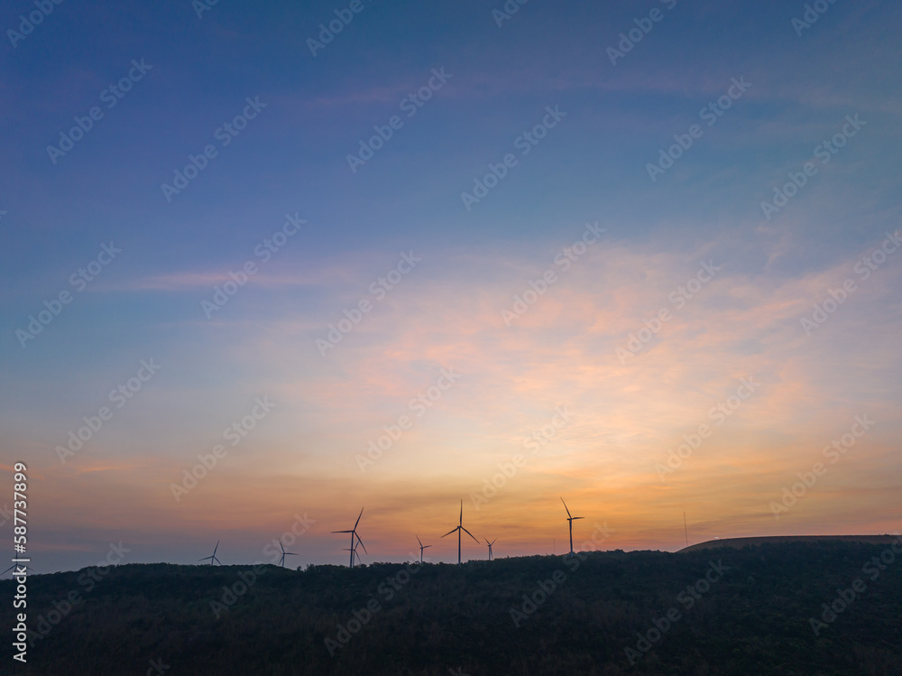 aerial view wind turbine viewpoint at Lamtakong dam,Nakhonratchasima, Thailand..amazing sky in sunrise above Lamtakong dam beautiful reflection on the large pond..Gradient color. Sky texture, aerial view wind turbine viewpoint at Lamtakong dam,Nakhonratchasima, Thailand..amazing sky in sunrise above Lamtakong dam beautiful reflection on the large pond..Gradient color. Sky texture,