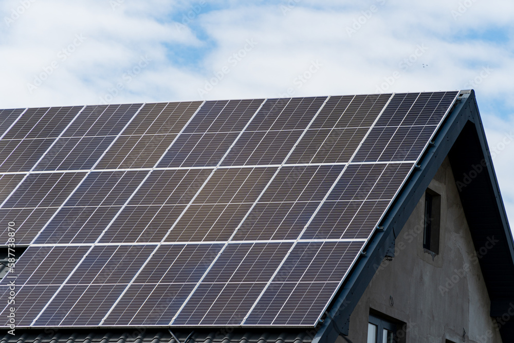 Solar panel on sheet black metal roof