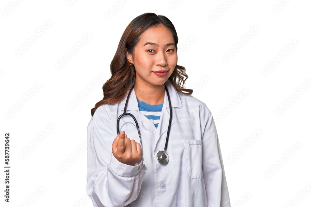A young asian doctor woman pointing with finger at you as if inviting come closer. A young asian doctor woman pointing with finger at you as if inviting come closer.