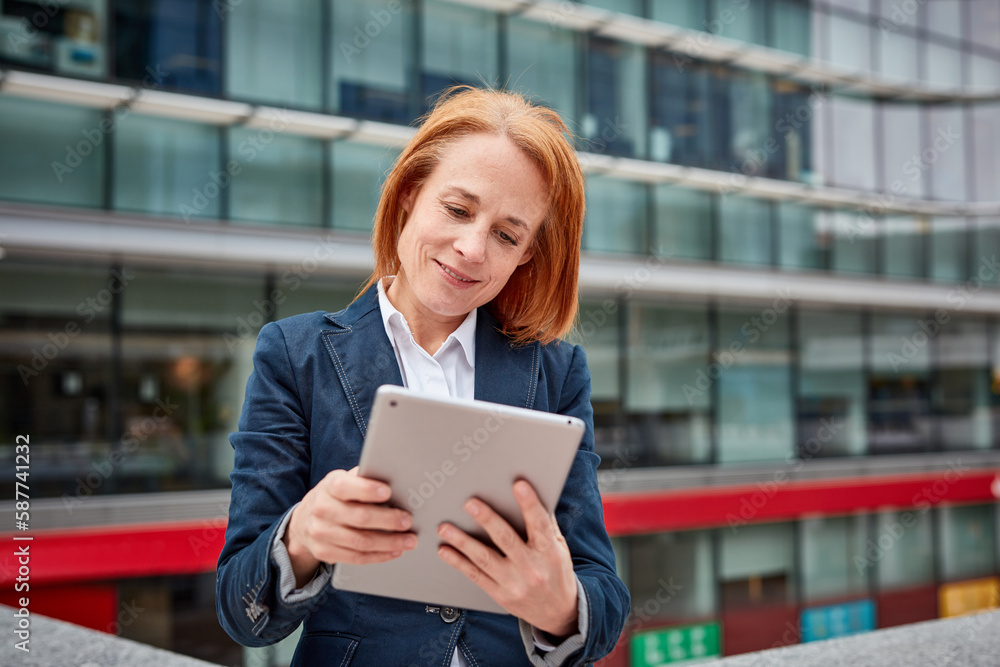 Fototapeta premium A tech-savvy businesswoman! Her digital skills and innovation drive progress while surrounded by the corporate world.