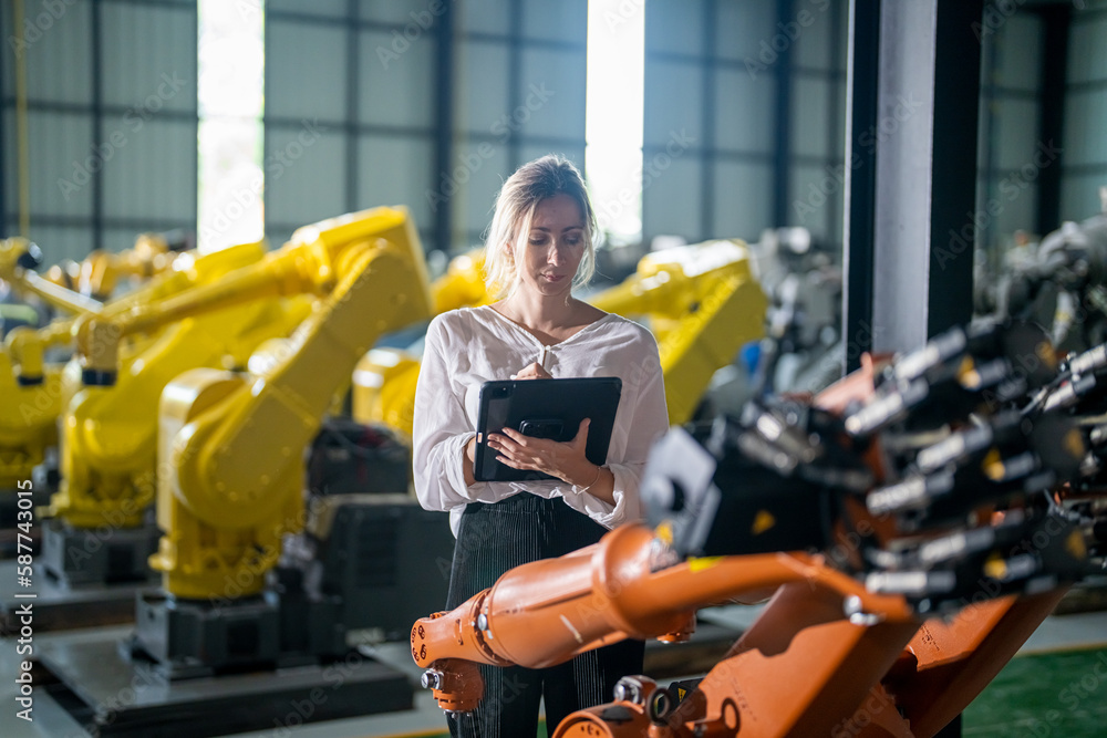 Fototapeta premium Engineer with robot in automotive parts factory