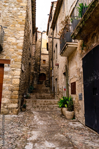 Stone stairs in the middle of an old medieval street in Spain © Noemie