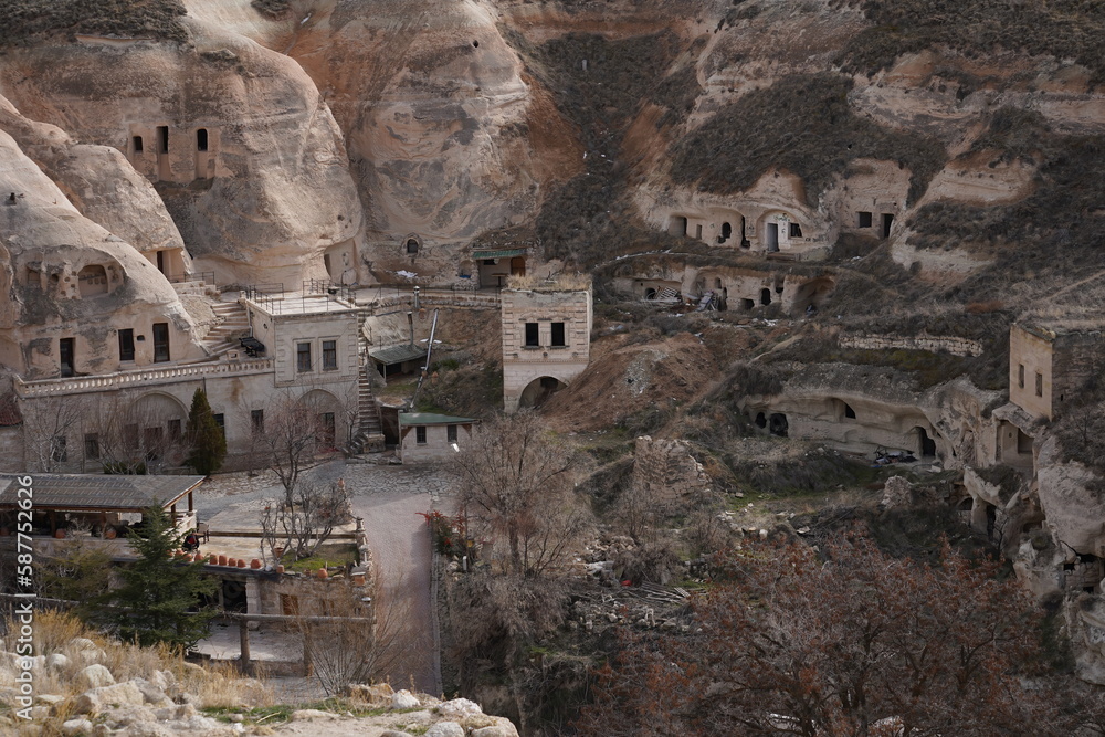 View of ancient houses carved into the rocks of Cappadocia