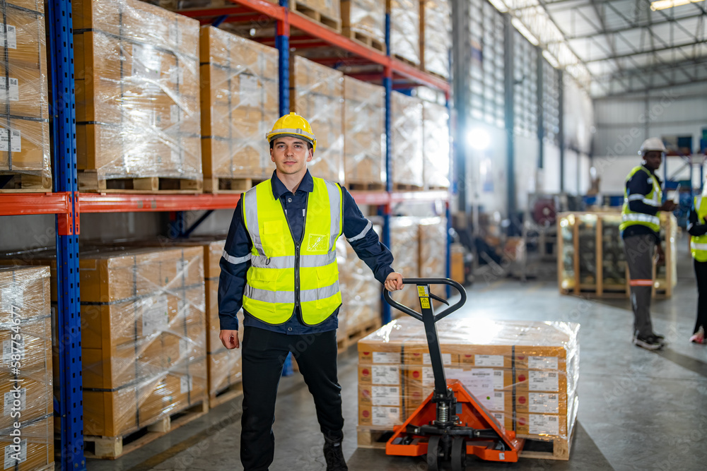 Warehouse workers with uniform working in distribution warehouse. Warehouse workers with uniform working in distribution warehouse.