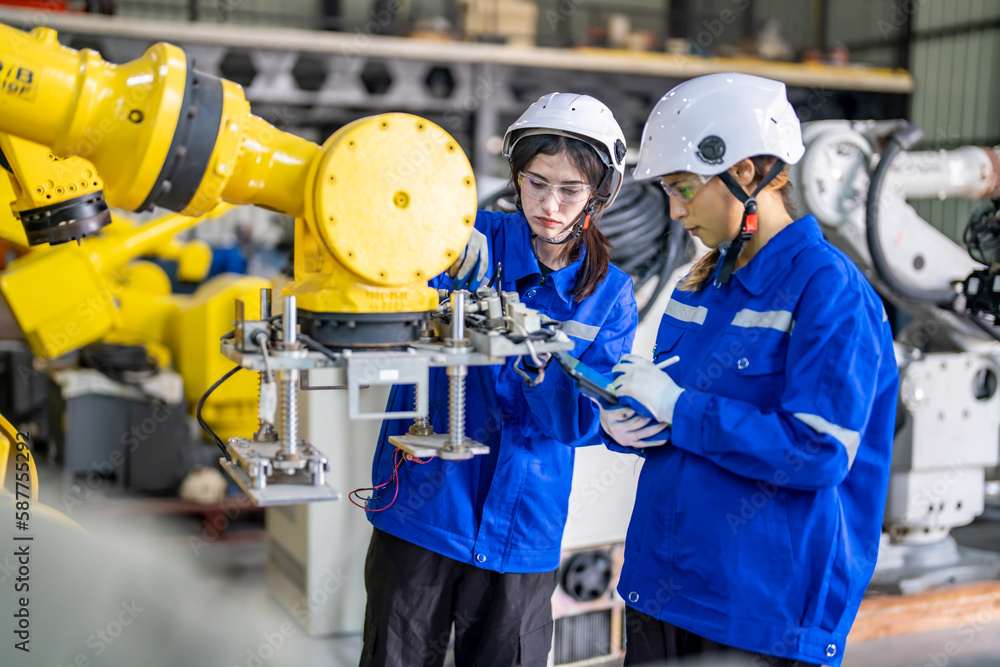 Industry 4.0: Engineer Monitoring Robotics Welding in Intelligent Factory. Digital manufacturing operation. Industry 4.0: Engineer Monitoring Robotics Welding in Intelligent Factory. Digital manufacturing operation.