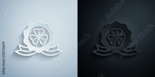 Paper cut Medal with clover trefoil leaf icon isolated on grey and black background. Happy Saint Patricks day. National Irish holiday. Paper art style. Vector