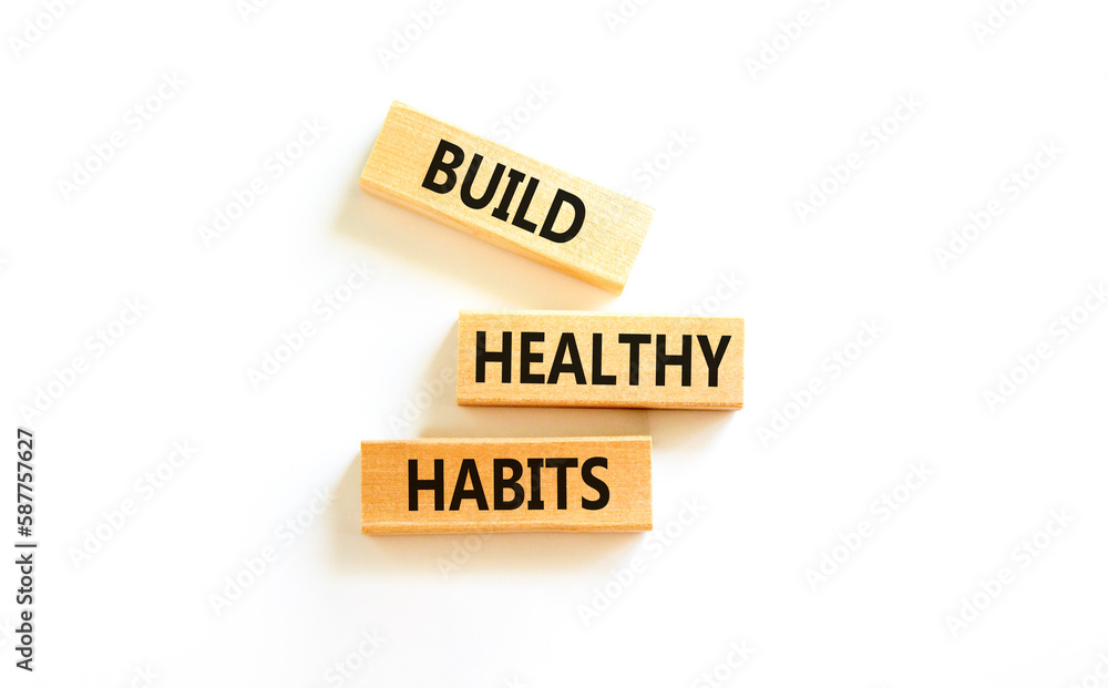 Motivation and Build healthy habits symbol. Concept words Build healthy habits on wooden block on a beautiful white table white background. Business build healthy habits concept. Copy space. Motivation and Build healthy habits symbol. Concept words Build healthy habits on wooden block on a beautiful white table white background. Business build healthy habits concept. Copy space.