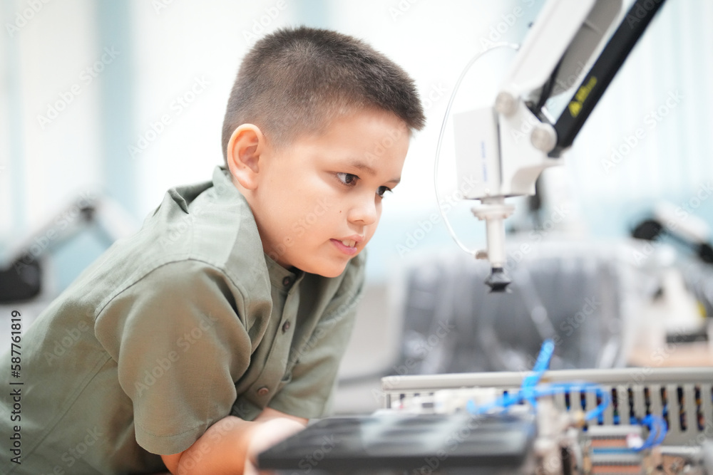 Children learning AI technology Robot with artificial intelligence system on its about the artificial intelligence during science lesson. Children learning AI technology Robot with artificial intelligence system on its about the artificial intelligence during science lesson.