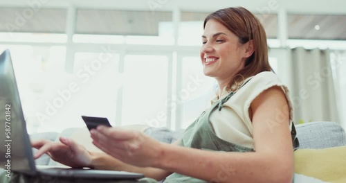 Happy woman, laptop and credit card for online shopping, ecommerce or purchase on living room sofa at home. Female shopper smiling for internet banking, wireless transaction or bank app on couch