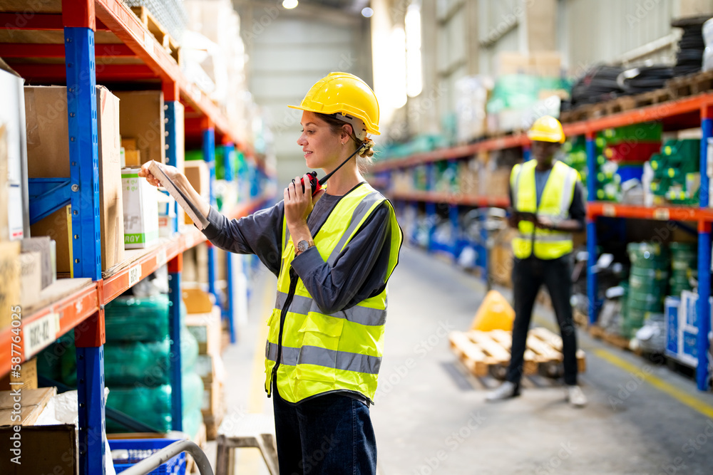 Warehouse Industrial supply chain and Logistics Companies inside. Warehouse workers checking the inventory. Products on inventory shelves storage. .Worker Doing Inventory in Warehouse. Warehouse Industrial supply chain and Logistics Companies inside. Warehouse workers checking the inventory. Products on inventory shelves storage. .Worker Doing Inventory in Warehouse.