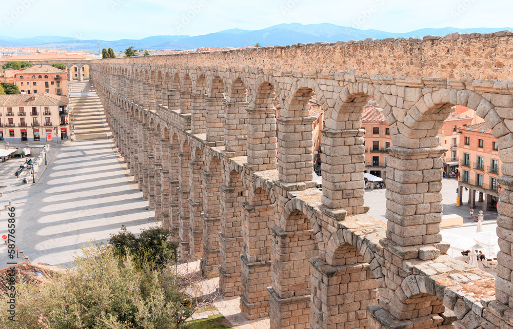 Tourism at Segovia,  Roman aqueduct on plaza del Azoguejo in Spain