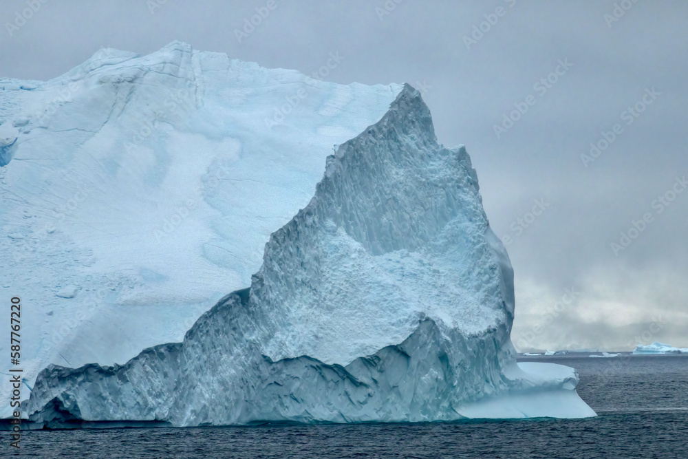 Pinnacle Iceberg floating in Charlotte Bay on the Antarctic Peninsula