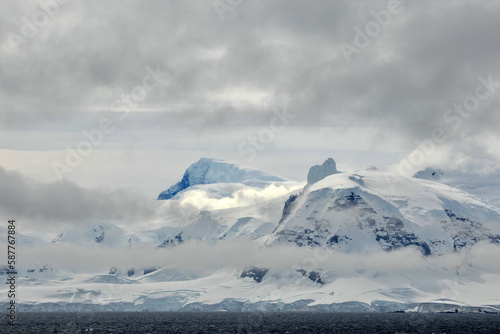 Beautiful snowy mountain scene in the Gerlache Strait in Antarctica photo