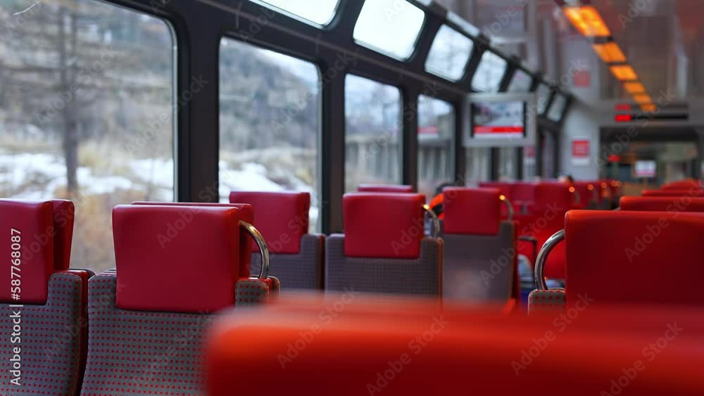 Riding a train on Zermatt Shuttle line in the Swiss Alps arriving to the station. This famous mountain resort town is not accessible by car for ecological reasons. Riding a train on Zermatt Shuttle line in the Swiss Alps arriving to the station. This famous mountain resort town is not accessible by car for ecological reasons.