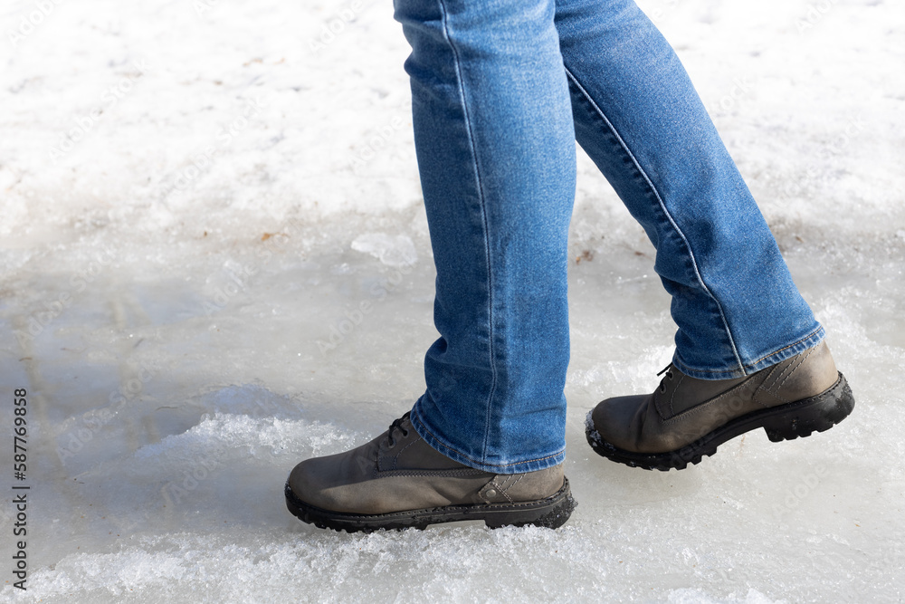 man walking on ice in the park. man walking on ice in the park.