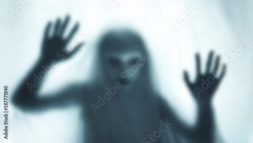 Heavy wave distortion nightmare fx: an evil ghost behind a veil or fabric, angry, showing her hands.

