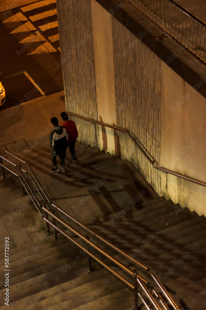 Two guys walking down stairs Two guys walking down stairs