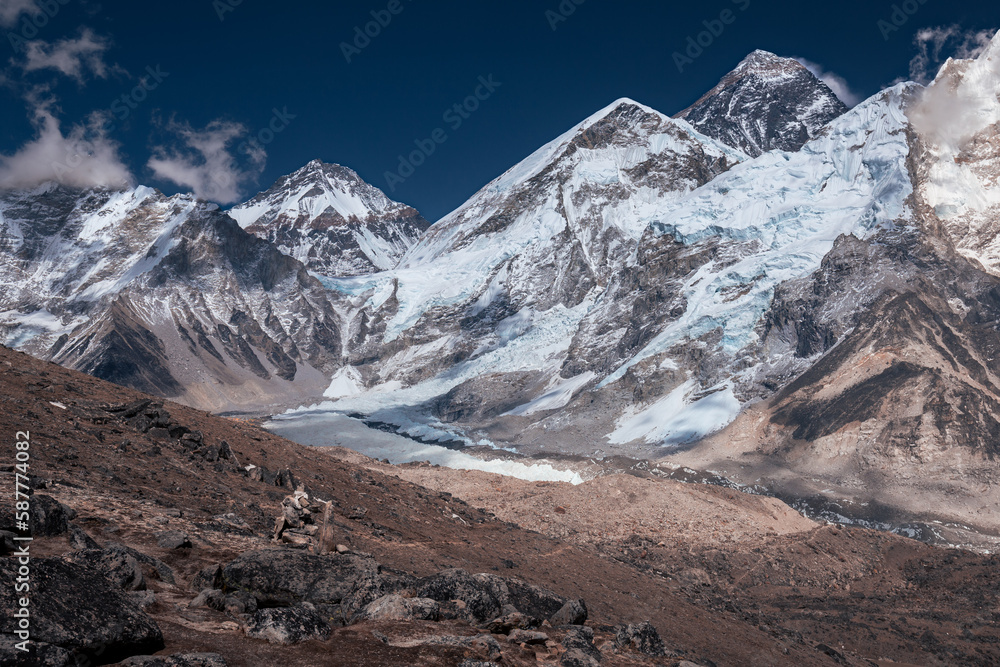 Mount Changtse, Everest, Nuptse and Everest base camp on Khumbu glacier under dramatic sky, Himalaya