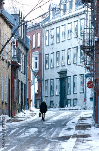 Woman walking in streets of Old Quebec City.