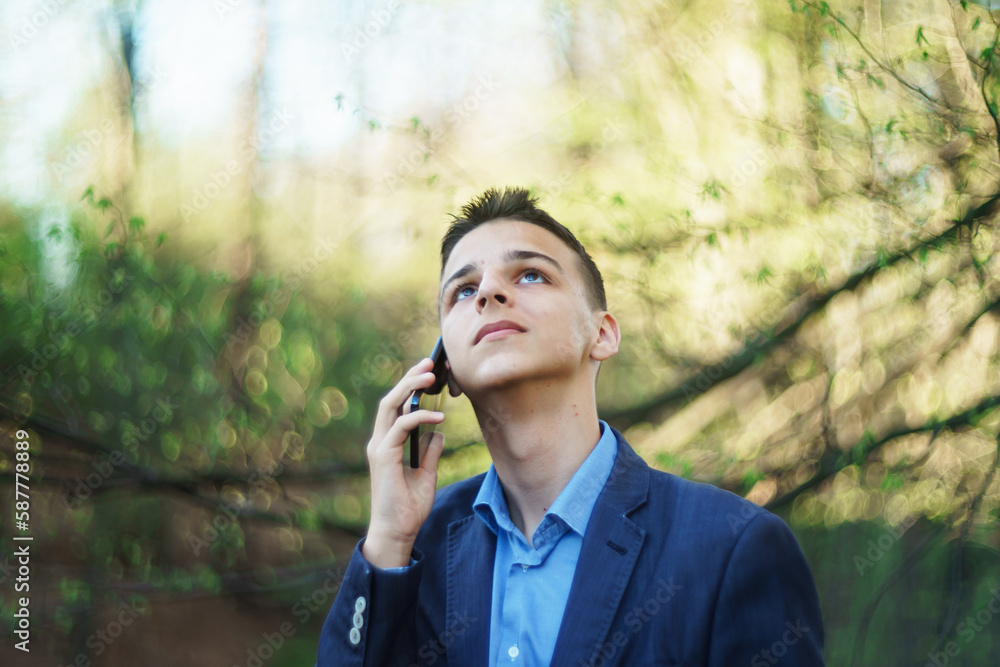 photo boy with a mobile phone in various poses, the concept of modern life photo boy with a mobile phone in various poses, the concept of modern life