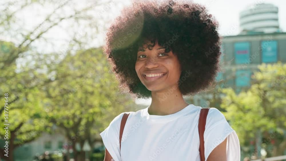 A portrait of African American girl with curly afro hairstyle stands ...