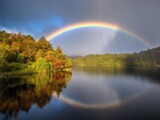 Rainbow over the lake in autumn