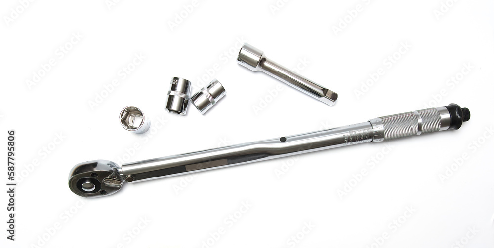 torque wrench on a white background. Adjustable torque wrench spanner hand tool and different nuts. torque wrench on a white background. Adjustable torque wrench spanner hand tool and different nuts.