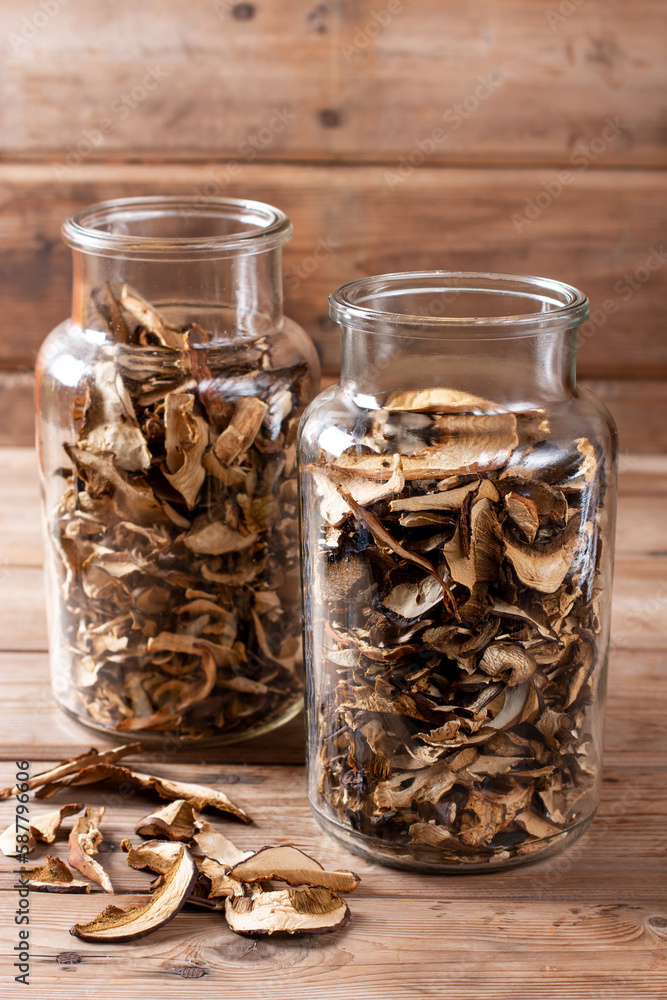 Dried mushrooms. Mushrooms in jar on the wooden table