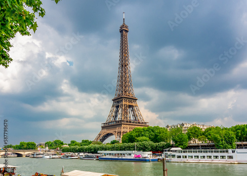 Eiffel Tower and boats along Seine river, Paris, France