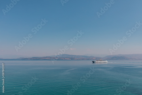 Fototapeta Naklejka Na Ścianę i Meble -  Boat near Old Venetian Fortress, Corfu, Greece