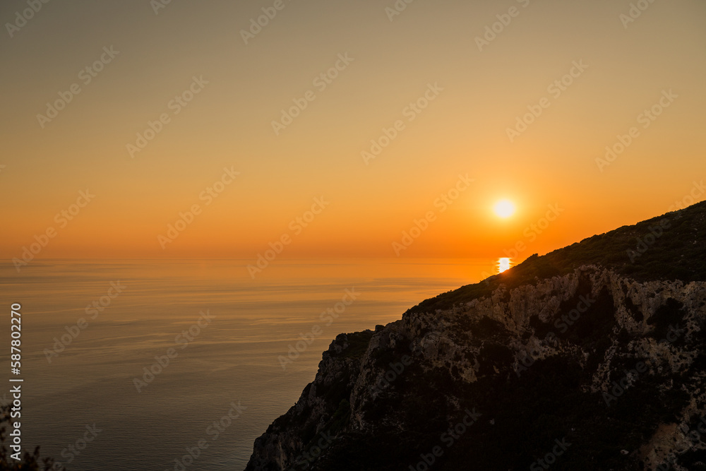 Amazing sunset seen from Angelokastro hill, Corfu, Greece