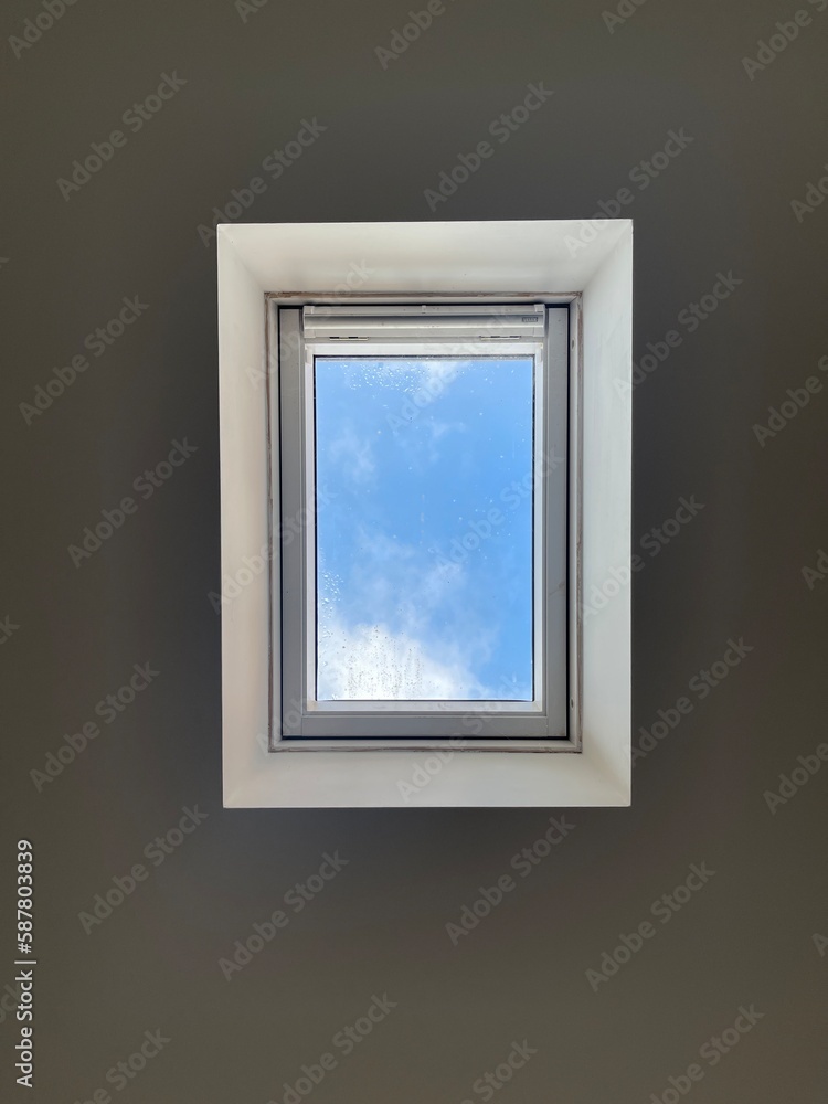Beautiful blue sky seen in a ceiling window, perspective shot Beautiful blue sky seen in a ceiling window, perspective shot